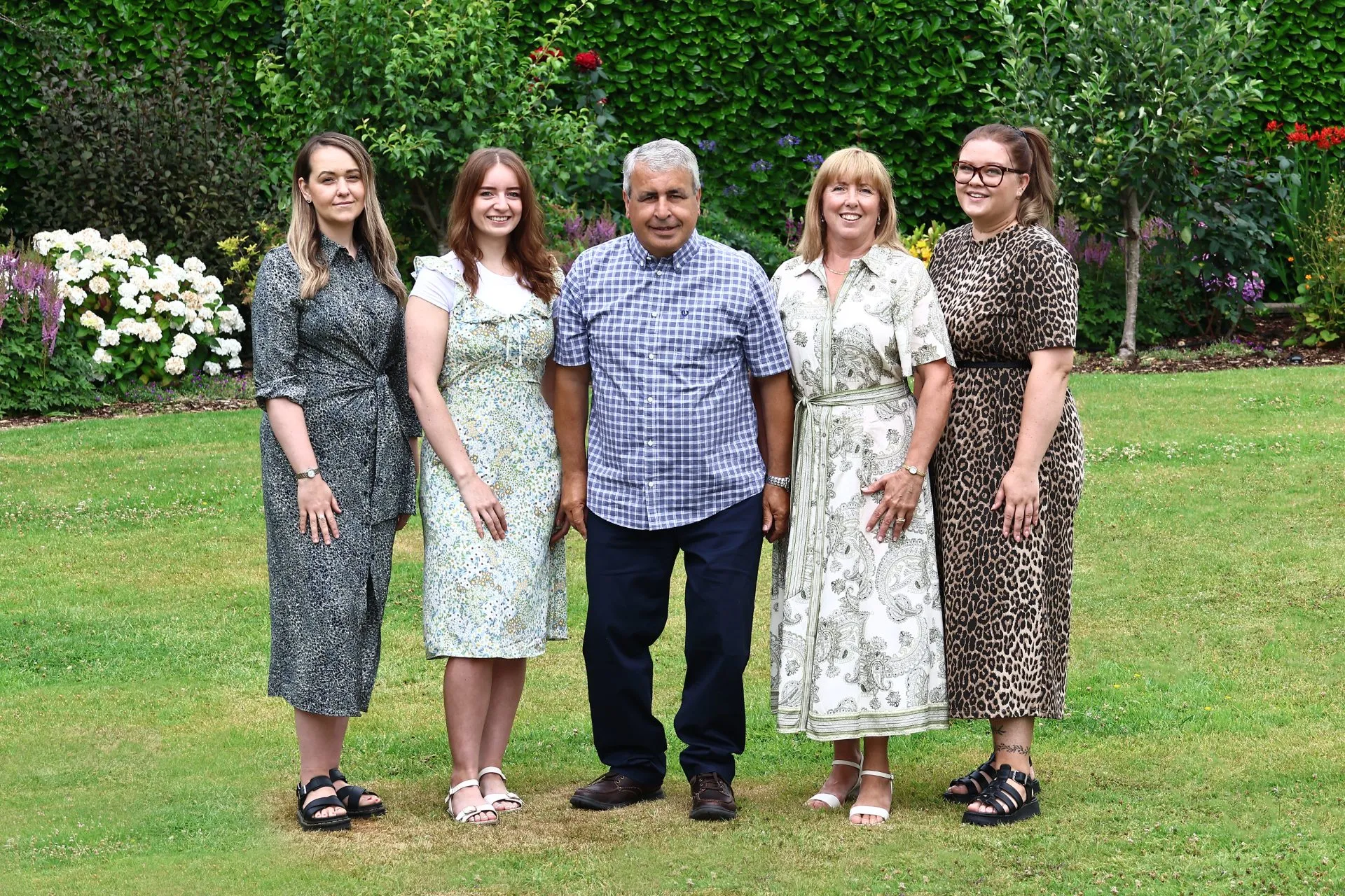 The family and photography team behind Paolo Loraso Photography, in the garden