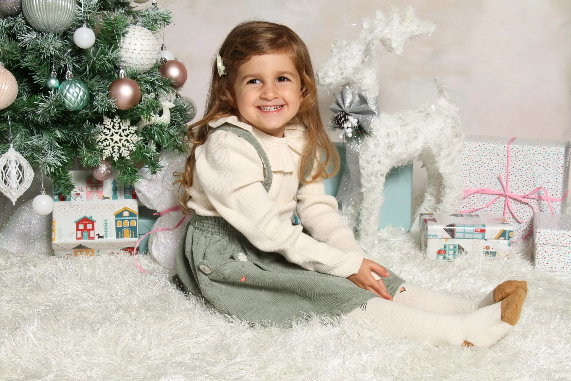 A child by a Christmas scene