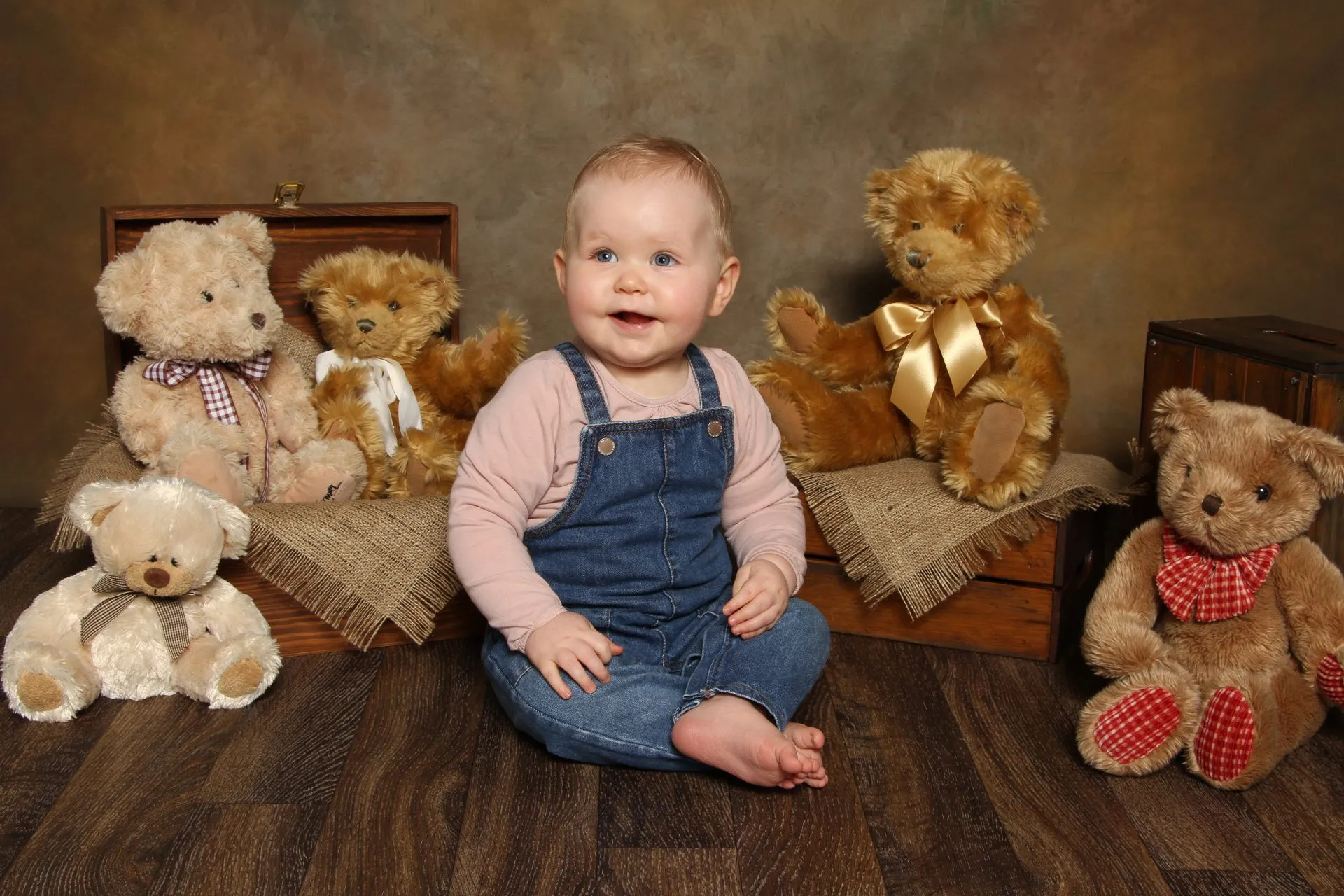A child in a teddy bear nursery set