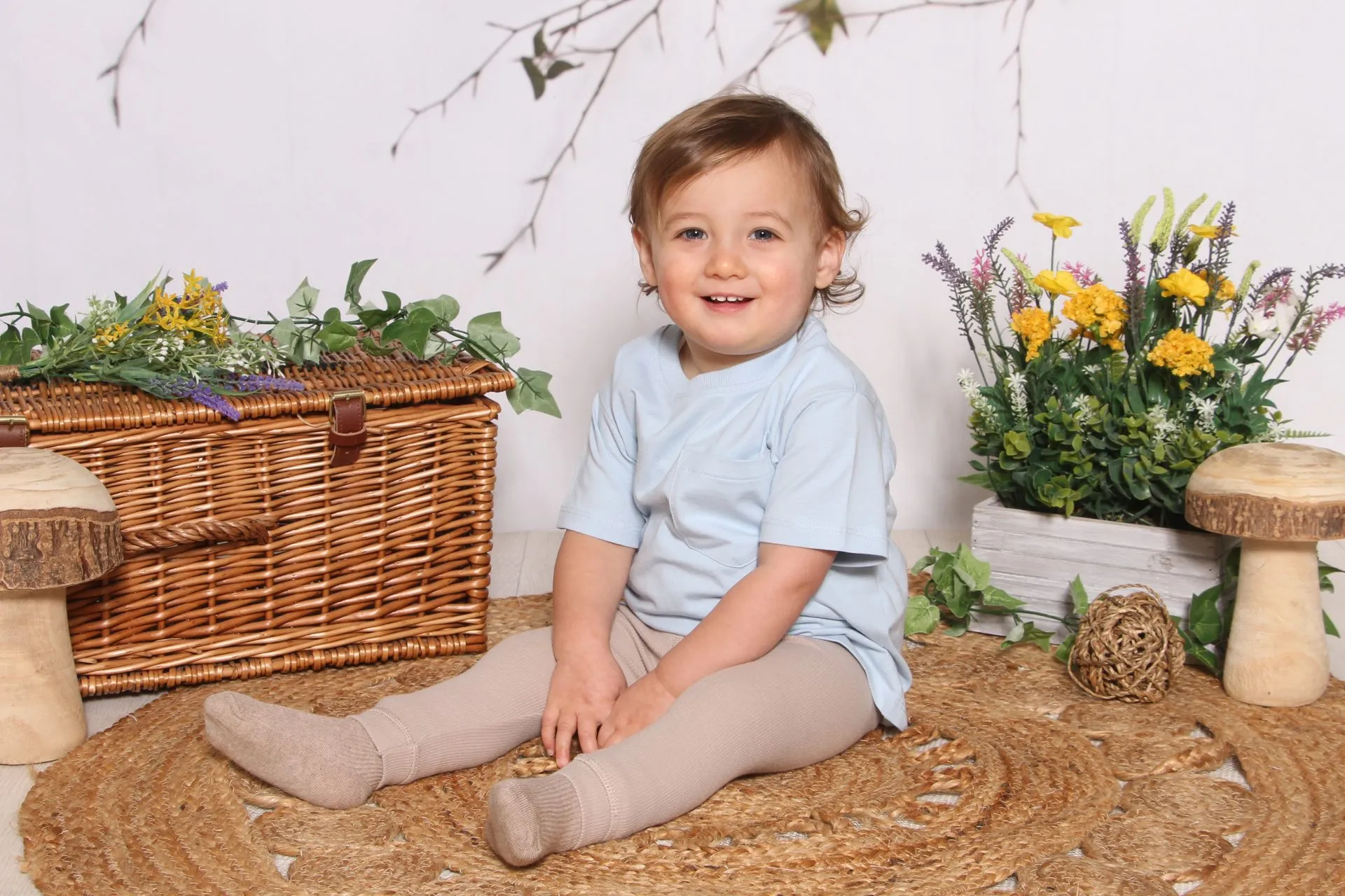 Child infront of Srping flower jute rug scene
